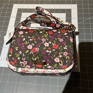 Brand New Kate Spade handbag with tag still on. Too small for me but cute!